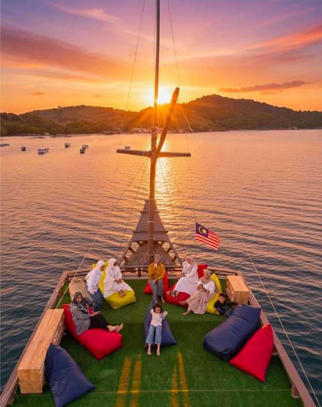 Guests relaxing on the upper deck at sunset